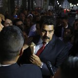 Venezuela's President Nicolas Maduro (C) greets supporters after his meeting with representatives of the Venezuelan coalition of opposition Venezuela's President Nicolas Maduro (C) greets supporters after his meeting with representatives of the Venezuelan coalition of opposition