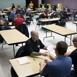 Members of the International Association of Machinists and Aerospace Workers from District 751 count votes at their union hall in Seattle, W Members of the International Association of Machinists and Aerospace Workers from District 751 count votes at their union hall in Seattle, W