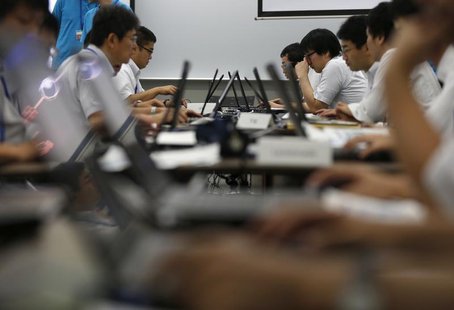 Participants from government ministries and agencies take part in the Cyber Defense Exercise with Recurrence (CYDER) in Tokyo September 25, Participants from government ministries and agencies take part in the Cyber Defense Exercise with Recurrence (CYDER) in Tokyo September 25,