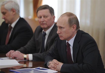 Russian President Vladimir Putin (R) chairs a meeting at the Novo-Ogaryovo state residence outside Moscow, April 10, 2014. REUTERS/Mikhail K Russian President Vladimir Putin (R) chairs a meeting at the Novo-Ogaryovo state residence outside Moscow, April 10, 2014. REUTERS/Mikhail K