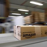 A parcel moves on the conveyor belt at Amazon's logistics centre in Graben near Augsburg December 16, 2013. REUTERS/Michaela Rehle A parcel moves on the conveyor belt at Amazon's logistics centre in Graben near Augsburg December 16, 2013. REUTERS/Michaela Rehle