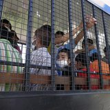 Suspected Uighurs are transported back to a detention facility in the town of Songkhla in southern Thailand after visiting women and childre Suspected Uighurs are transported back to a detention facility in the town of Songkhla in southern Thailand after visiting women and childre