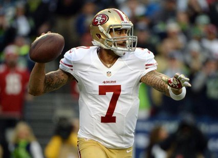 Jan 19, 2014; Seattle, WA, USA; San Francisco 49ers quarterback Colin Kaepernick (7) drops back to pass against the Seattle Seahawks during Jan 19, 2014; Seattle, WA, USA; San Francisco 49ers quarterback Colin Kaepernick (7) drops back to pass against the Seattle Seahawks during