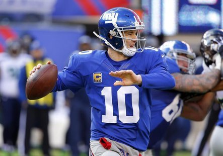 Dec 15, 2013; East Rutherford, NJ, USA; New York Giants quarterback Eli Manning (10) throws a pass during the first half against the Seattle Dec 15, 2013; East Rutherford, NJ, USA; New York Giants quarterback Eli Manning (10) throws a pass during the first half against the Seattle
