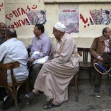 People sit at a cafe near posters of presidential candidate and former Egyptian army chief Field Marshal Abdel Fattah al-Sisi in central Cai People sit at a cafe near posters of presidential candidate and former Egyptian army chief Field Marshal Abdel Fattah al-Sisi in central Cai