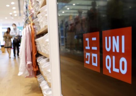 Shoppers walk at Fast Retailing Co's Uniqlo casual fashion chain store in Tokyo April 10, 2013. REUTERS/Yuya Shino Shoppers walk at Fast Retailing Co's Uniqlo casual fashion chain store in Tokyo April 10, 2013. REUTERS/Yuya Shino