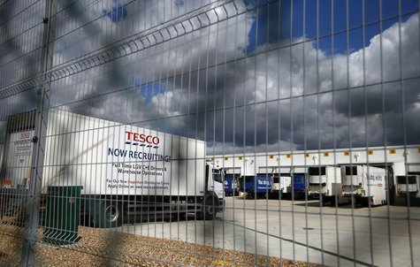 A lorry with job advertisements on its side is seen parked at Tesco's new distribution centre in Dagenham, east London August 12, 2013. REUT A lorry with job advertisements on its side is seen parked at Tesco's new distribution centre in Dagenham, east London August 12, 2013. REUT
