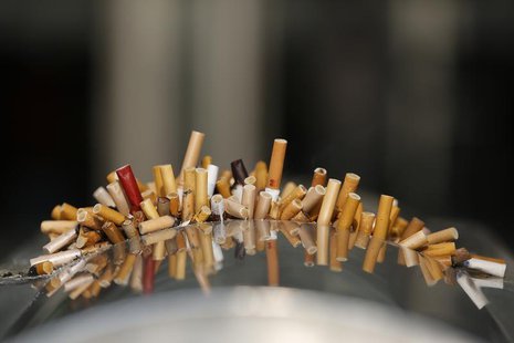 Extinguished cigarettes are seen in an ashtray at the Shanghai Railway Station December 23, 2013. REUTERS/Aly Song Extinguished cigarettes are seen in an ashtray at the Shanghai Railway Station December 23, 2013. REUTERS/Aly Song