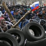 Pro-Russia protesters gather in front of a barricade outside a regional government building in Donetsk, in eastern Ukraine April 11, 2014. R Pro-Russia protesters gather in front of a barricade outside a regional government building in Donetsk, in eastern Ukraine April 11, 2014. R