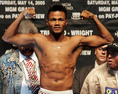 Middleweight boxer Felix "Tito" Trinidad of Cupey Alto, Puerto Rico poses on the scale during an official weigh-in at the MGM Grand Garden A Middleweight boxer Felix "Tito" Trinidad of Cupey Alto, Puerto Rico poses on the scale during an official weigh-in at the MGM Grand Garden A