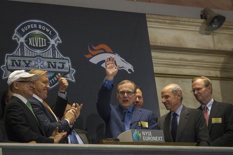 Seattle Seahawks owner and Microsoft co-founder Paul Allen (C) waves to the trading floor after ringing the opening bell at the New York Sto Seattle Seahawks owner and Microsoft co-founder Paul Allen (C) waves to the trading floor after ringing the opening bell at the New York Sto