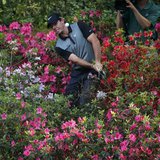 Northern Ireland's Rory McIlroy hits from the azaleas on the 13th hole during the second round of the Masters golf tournament at the Augusta Northern Ireland's Rory McIlroy hits from the azaleas on the 13th hole during the second round of the Masters golf tournament at the Augusta