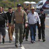 Rancher Cliven Bundy (2nd R) is escorted in Bunkerville, Nevada, April 11, 2014. REUTERS/Jim Urquhart Rancher Cliven Bundy (2nd R) is escorted in Bunkerville, Nevada, April 11, 2014. REUTERS/Jim Urquhart
