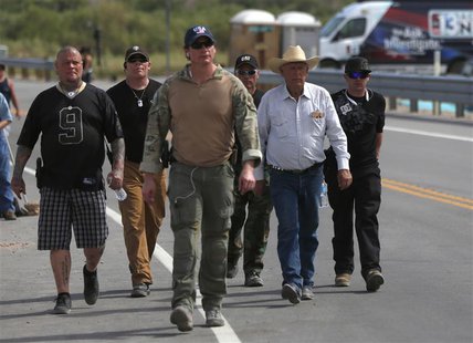 Rancher Cliven Bundy (2nd R) is escorted in Bunkerville, Nevada, April 11, 2014. REUTERS/Jim Urquhart Rancher Cliven Bundy (2nd R) is escorted in Bunkerville, Nevada, April 11, 2014. REUTERS/Jim Urquhart