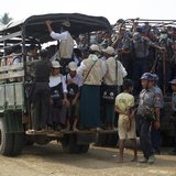 Volunteers and police board vehicles before proceeding to Rohingya refugee camps to collect data for the census in Sittwe March 31, 2014. RE Volunteers and police board vehicles before proceeding to Rohingya refugee camps to collect data for the census in Sittwe March 31, 2014. RE