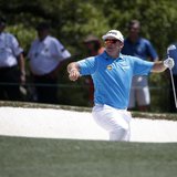 Britain's Lee Westwood climbs from the sand trap after a shot on the first hole during the third round of the Masters golf tournament at the Britain's Lee Westwood climbs from the sand trap after a shot on the first hole during the third round of the Masters golf tournament at the