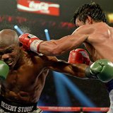 Apr 12, 2014; Las Vegas, NV, USA; Timothy Bradley Jr.(brown gloves) and Manny Pacquiao (red gloves) during their WBO World Welterweight Cham Apr 12, 2014; Las Vegas, NV, USA; Timothy Bradley Jr.(brown gloves) and Manny Pacquiao (red gloves) during their WBO World Welterweight Cham