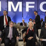 IMF Managing Director Christine Lagarde (C) takes her seat as she joins IMF First Deputy Managing Director David Lipton (L) and Singapore's IMF Managing Director Christine Lagarde (C) takes her seat as she joins IMF First Deputy Managing Director David Lipton (L) and Singapore's