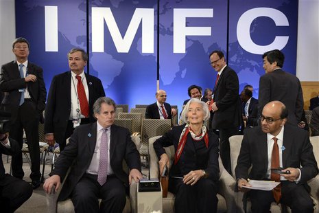 IMF Managing Director Christine Lagarde (C) takes her seat as she joins IMF First Deputy Managing Director David Lipton (L) and Singapore's IMF Managing Director Christine Lagarde (C) takes her seat as she joins IMF First Deputy Managing Director David Lipton (L) and Singapore's