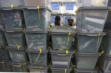 Afghan electoral workers sort ballot boxes at a counting centre in Kabul April 10, 2014. REUTERS/Omar Sobhani Afghan electoral workers sort ballot boxes at a counting centre in Kabul April 10, 2014. REUTERS/Omar Sobhani