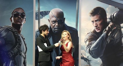 Actress Scarlett Johansson (R) gestures to the crowd during an interview at the UK premiere of "Captain America: The Winter Soldier: at Shep Actress Scarlett Johansson (R) gestures to the crowd during an interview at the UK premiere of "Captain America: The Winter Soldier: at Shep