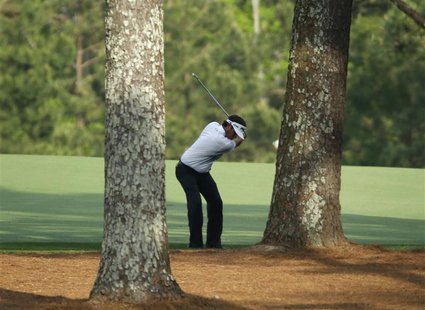 U.S. golfer Bubba Watson hits a shot from behind the trees on the 15th hole during the final round of the Masters golf tournament at the Aug U.S. golfer Bubba Watson hits a shot from behind the trees on the 15th hole during the final round of the Masters golf tournament at the Aug