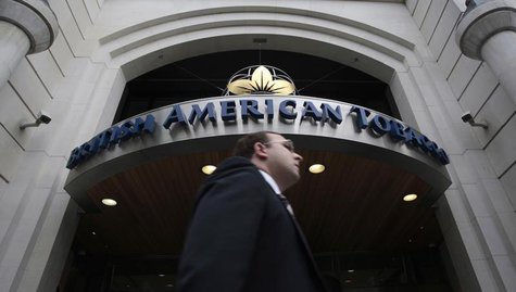 A man walks past the British American Tobacco offices in London May 6, 2009. REUTERS/Luke MacGregor A man walks past the British American Tobacco offices in London May 6, 2009. REUTERS/Luke MacGregor
