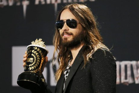Actor Jared Leto poses backstage with the award for Best Onscreen Transformation for "Dallas Buyers Club" at the 2014 MTV Movie Awards in Lo Actor Jared Leto poses backstage with the award for Best Onscreen Transformation for "Dallas Buyers Club" at the 2014 MTV Movie Awards in Lo