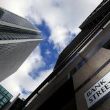 A sign for Bank Street and high rise offices are pictured in the financial district Canary Wharf in London in this October 21, 2010 file pho A sign for Bank Street and high rise offices are pictured in the financial district Canary Wharf in London in this October 21, 2010 file pho