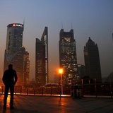 A man looks at the Pudong financial district of Shanghai November 20, 2013. REUTERS/Carlos Barria A man looks at the Pudong financial district of Shanghai November 20, 2013. REUTERS/Carlos Barria