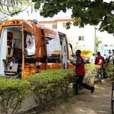 A Red Cross worker runs towards an ambulance carrying victims of a bomb blast at the Asokoro General Hospital in Abuja April 14, 2014. REUTE A Red Cross worker runs towards an ambulance carrying victims of a bomb blast at the Asokoro General Hospital in Abuja April 14, 2014. REUTE