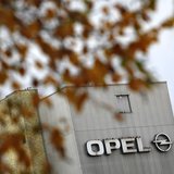 Leaves of a tree are pictured in front of a factory building with a logo of German car manufacturer Opel at the headquarters in Ruesselsheim Leaves of a tree are pictured in front of a factory building with a logo of German car manufacturer Opel at the headquarters in Ruesselsheim
