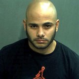 Robert Corchado, 28, is seen in a booking photo from the Orange County Jail in Orlando, Florida taken April 10, 2014. REUTERS/Orange County Robert Corchado, 28, is seen in a booking photo from the Orange County Jail in Orlando, Florida taken April 10, 2014. REUTERS/Orange County