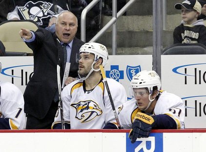 Nov 15, 2013; Pittsburgh, PA, USA; Nashville Predators head coach Barry Trotz (left) reacts on the bench against the Pittsburgh Penguins dur Nov 15, 2013; Pittsburgh, PA, USA; Nashville Predators head coach Barry Trotz (left) reacts on the bench against the Pittsburgh Penguins dur