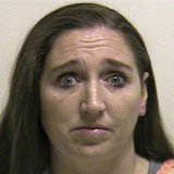 Megan Huntsman is shown in this booking photo provided by the Pleasant Grove County Jail in Pleasant Grove, Utah April 13, 2014. REUTERS/Ple Megan Huntsman is shown in this booking photo provided by the Pleasant Grove County Jail in Pleasant Grove, Utah April 13, 2014. REUTERS/Ple