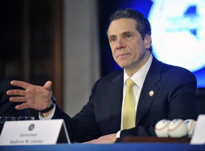 New York Governor Andrew Cuomo talks with reporters before signing the 2014-15 state budget at the State Capitol in Albany, New York, April New York Governor Andrew Cuomo talks with reporters before signing the 2014-15 state budget at the State Capitol in Albany, New York, April