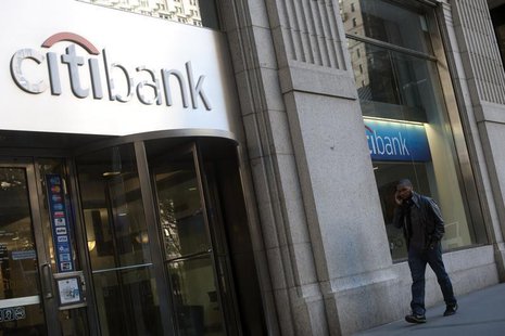 Passersby walk in front of a Citibank branch in New York, October 16, 2012. REUTERS/Keith Bedford Passersby walk in front of a Citibank branch in New York, October 16, 2012. REUTERS/Keith Bedford