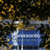 The logo of Panasonic Corp is seen behind trees outside its showroom in Tokyo November 14, 2012. REUTERS/Toru Hanai The logo of Panasonic Corp is seen behind trees outside its showroom in Tokyo November 14, 2012. REUTERS/Toru Hanai