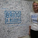 Jenna Furger with the UWSP Bring A Buddy banner, where over 1,500 students have pledged to bring a buddy instead of going out alone. Jenna Furger with the UWSP Bring A Buddy banner, where over 1,500 students have pledged to bring a buddy instead of going out alone.