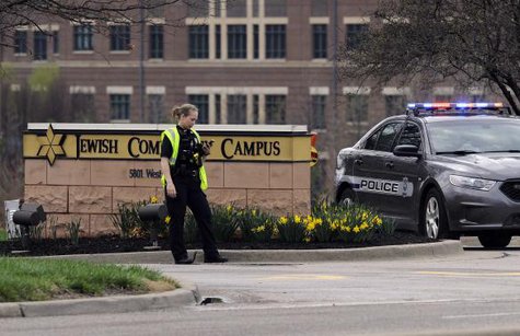 An Overland Park Kansas police officer guards the entrance to the scene of a shooting at the Jewish Community Center of Greater Kansas City in Overland Park, Kansas April 13, 2014. CREDIT: REUTERS/DAVE KAUP An Overland Park Kansas police officer guards the entrance to the scene of a shooting at the Jewish Community Center of Greater Kansas City in Overland Park, Kansas April 13, 2014. CREDIT: REUTERS/DAVE KAUP