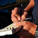 Illinois officer writes ticket Illinois officer writes ticket
