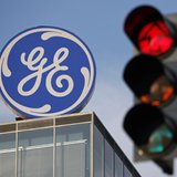 The logo of the GE Money Bank is seen behind a traffic light in Prague May 29, 2012. REUTERS/David W Cerny The logo of the GE Money Bank is seen behind a traffic light in Prague May 29, 2012. REUTERS/David W Cerny