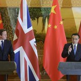 Britain's Prime Minister David Cameron (L) listens to China's Premier Li Keqiang as the two leaders deliver statements following a signing c Britain's Prime Minister David Cameron (L) listens to China's Premier Li Keqiang as the two leaders deliver statements following a signing c