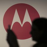 A woman takes a picture in front of a Motorola logo before the worldwide presentation of the Moto G mobile phone in Sao Paulo November 13, 2 A woman takes a picture in front of a Motorola logo before the worldwide presentation of the Moto G mobile phone in Sao Paulo November 13, 2