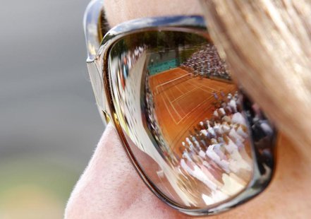 A spectator watches a match at the French Open tennis tournament at Roland Garros in Paris, May 28, 2010. REUTERS/Pascal Rossignol A spectator watches a match at the French Open tennis tournament at Roland Garros in Paris, May 28, 2010. REUTERS/Pascal Rossignol
