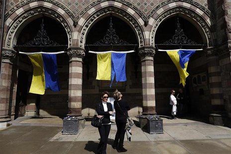 Pedestrians look at a marathon banner installation at the Old South Church on Boylston Street in Boston, Massachusetts, April 14, 2014. REUT Pedestrians look at a marathon banner installation at the Old South Church on Boylston Street in Boston, Massachusetts, April 14, 2014. REUT