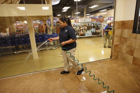 Vanessa Espinosa sanitizes a dog play room at a PetSmart PetsHotel and Doggie Day Camp in Los Angeles, California, May 14, 2012. REUTERS/Dav Vanessa Espinosa sanitizes a dog play room at a PetSmart PetsHotel and Doggie Day Camp in Los Angeles, California, May 14, 2012. REUTERS/Dav
