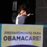 Julissa Esparza, 2, sleeps in the arms of her grandfather Leobardo Salazar, 58, as they wait in line at a health insurance enrollment event Julissa Esparza, 2, sleeps in the arms of her grandfather Leobardo Salazar, 58, as they wait in line at a health insurance enrollment event