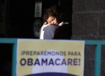 Julissa Esparza, 2, sleeps in the arms of her grandfather Leobardo Salazar, 58, as they wait in line at a health insurance enrollment event Julissa Esparza, 2, sleeps in the arms of her grandfather Leobardo Salazar, 58, as they wait in line at a health insurance enrollment event