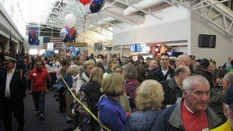 Crowds pack Central Wisconsin Airport waiting for vets returning from the Never Forgotten Honor Flight (taken by Raymond Neupert, 04/14/14) Crowds pack Central Wisconsin Airport waiting for vets returning from the Never Forgotten Honor Flight (taken by Raymond Neupert, 04/14/14)